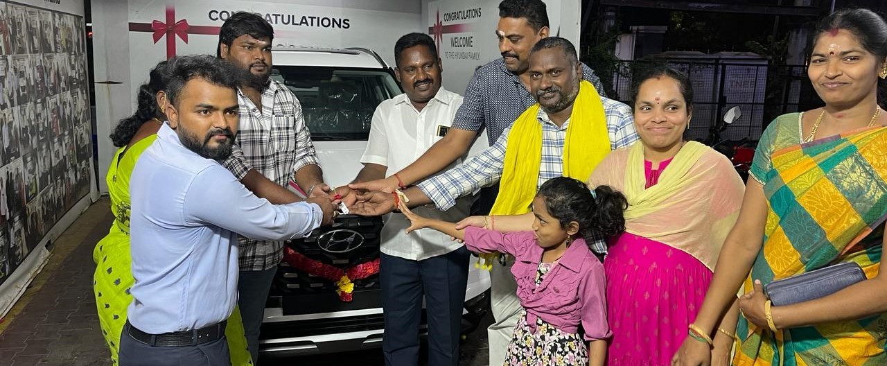 Happy family takes delivery of new Hyundai car through car loan from Car Loan Madurai – Sakthi Associates in Tamil Nadu